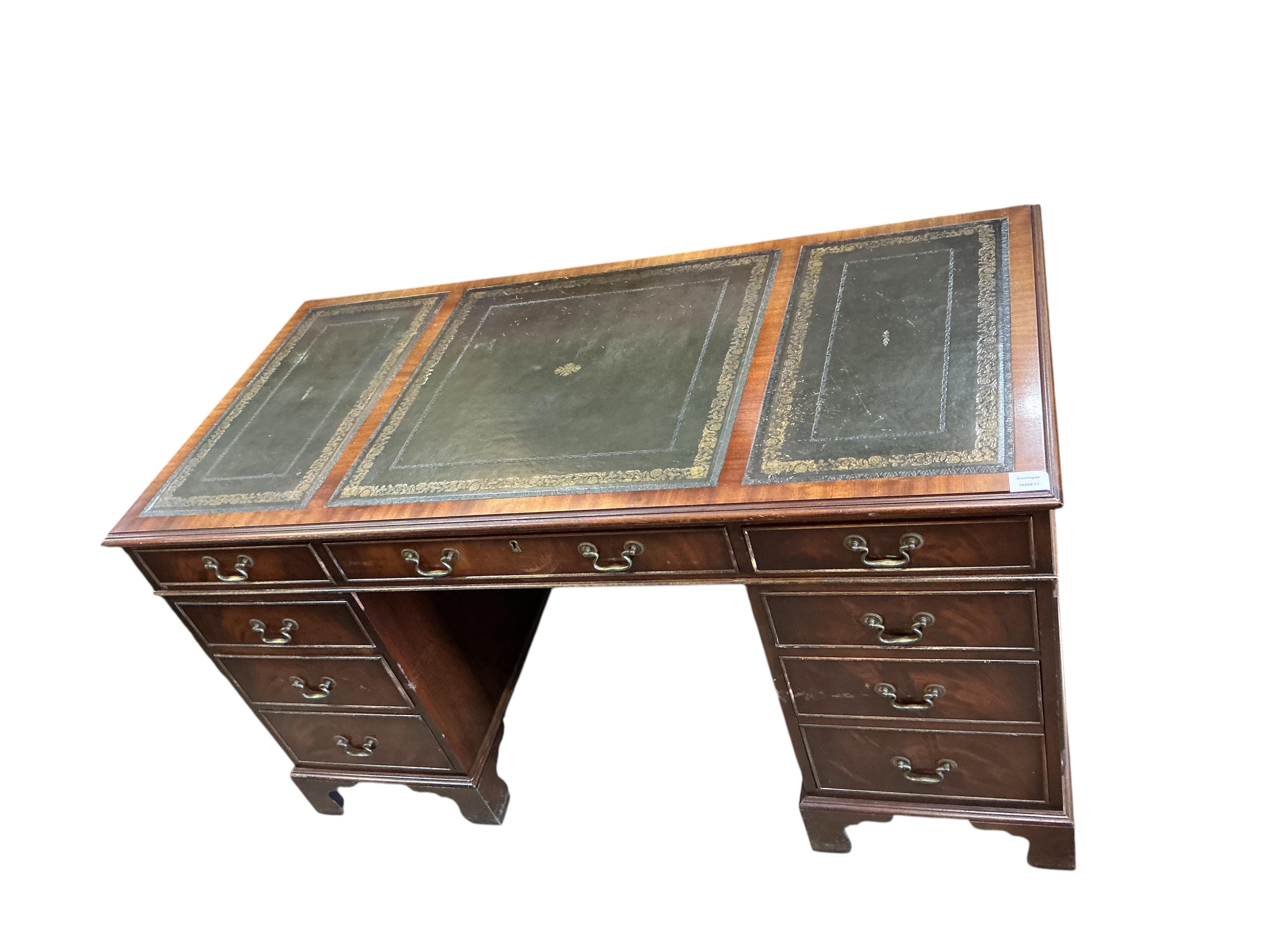 A reproduction mahogany pedestal desk, width 140cm, depth 68cm, height 76cm